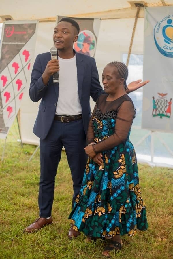 A speaker celebrating a community member on stage